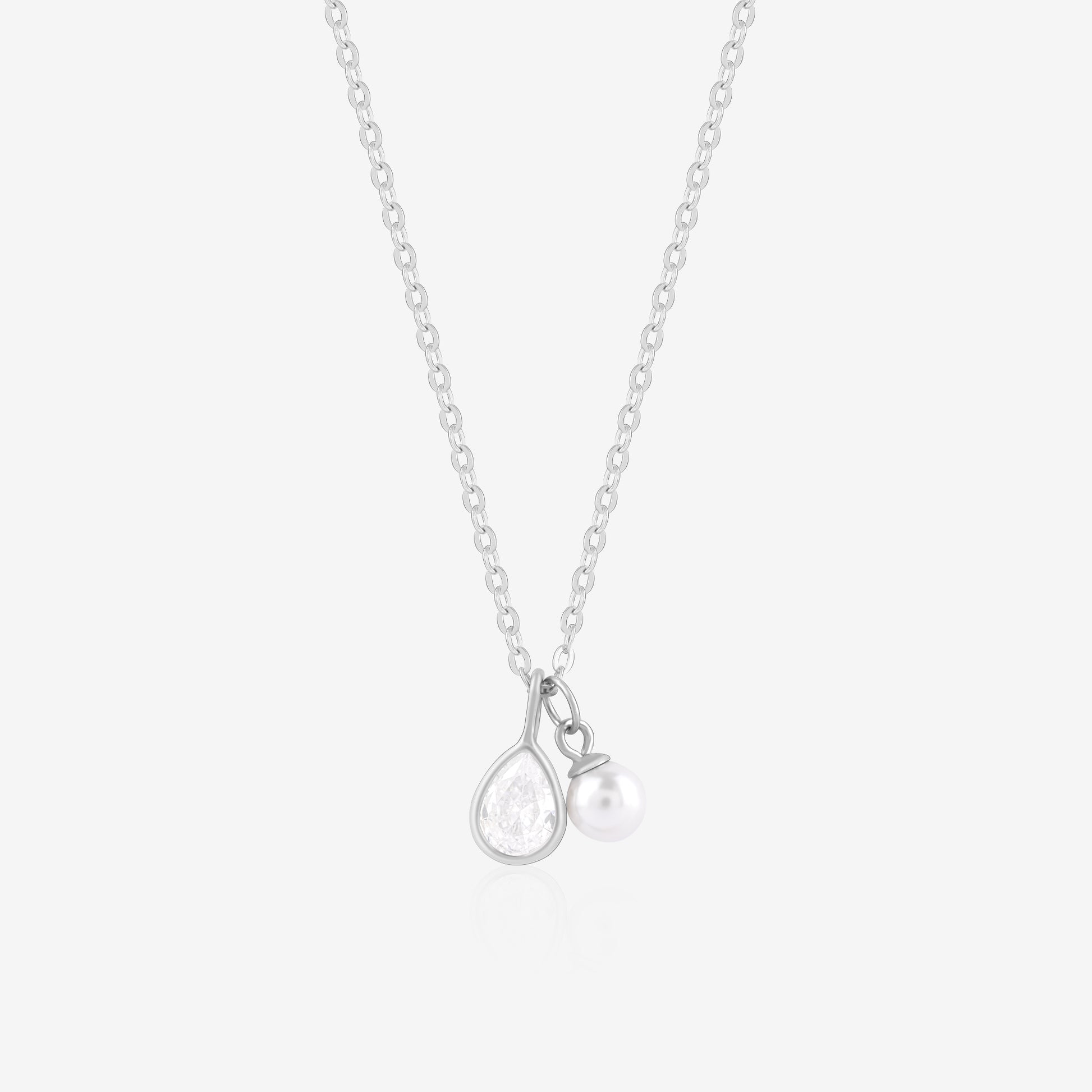 Silver necklace with a teardrop-shaped pendant on a light gray background