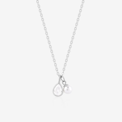 Silver necklace with a teardrop-shaped pendant on a light gray background